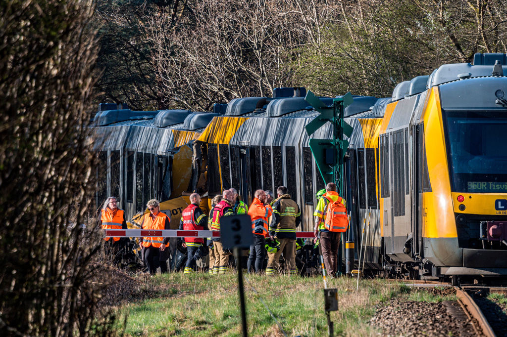 Rescuers at the site where two trains have collided between Hilleroed and Kagerup, north of Copenhagen, Thursday, April 23, 2026. (Steven Knap/Ritzau Scanpix via AP)