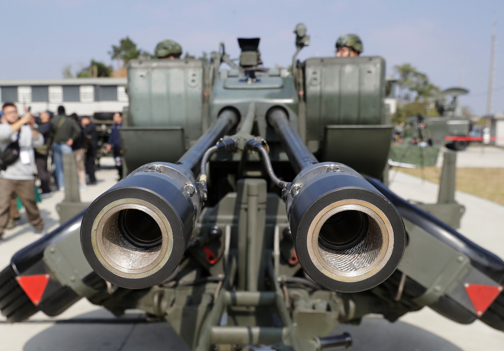 Soldiers stand by to conduct a practice operation of a GDF-006 AHEAD 35 mm twin cannon during a military exercise in Chiayi County, Taiwan, Wednesday, Jan. 28, 2026. (AP Photo/Chiang Ying-ying)