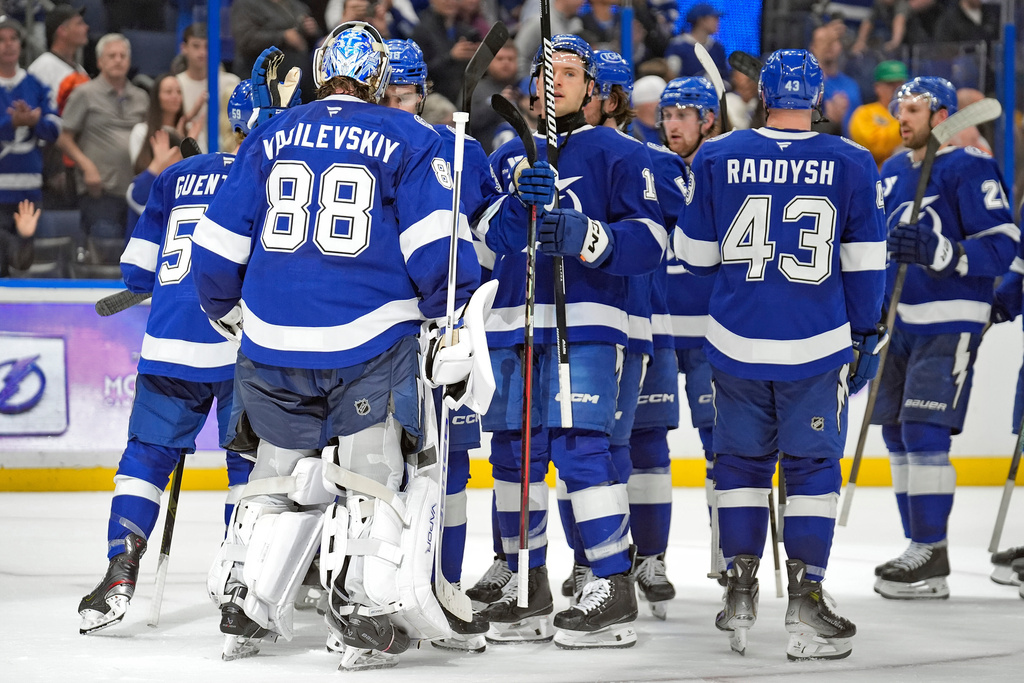 Tampa Bay Lightning goaltender Andrei Vasilevskiy (88) celebrates with teammates after the team defeated the Philadelphia Flyers during an NHL hockey game Monday, Nov. 24, 2025, in Tampa, Fla. (AP Photo/Chris O'Meara)
