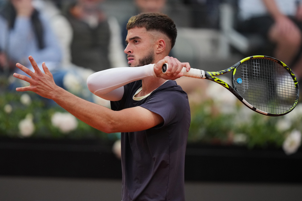 Croatia's Dino Prizmic returns the ball to Serbia's Novak Djokovic during their match at the Italian Open tennis tournament, in Rome, Friday, May 8, 2026. (AP Photo/Andrew Medichini)