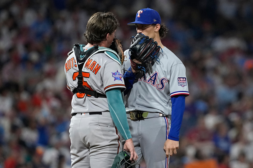 Baltimore Orioles' Adley Rutschman, left, Texas Rangers pitcher Jacob Latz talk in the seventh inning during the MLB baseball All-Star Game between the American League and National League, Tuesday, July 14, 2026, in Philadelphia. (AP Photo/Matt Slocum)