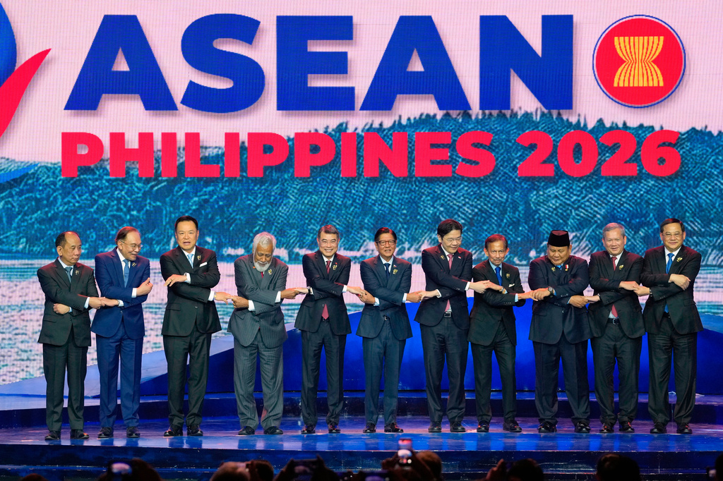 From left, Myanmar's Permanent Secretary of the Ministry of Foreign Affairs U Hau Khan Sum, Malaysia's Prime Minister Anwar Ibrahim, Thailand's Prime Minister Anutin Charnvirakul, East Timor's Prime Minister Xanana Gusmao, Vietnam's Prime Minister Le Minh Hung, Philippine President Ferdinand Marcos Jr., Singapore's Prime Minister Lawrence Wong, Brunei's Sultan Hassanal Bolkiah, Indonesia's President Prabowo Subianto, Cambodia's Prime Minister Hun Manet, and Laos' Prime Minister Sonexay Siphandone hold hands for a group photo during the opening ceremony of the 48th ASEAN summit and Related Meeting in Cebu, Philippines on Friday, May 8, 2026. (AP Photo/Aaron Favila, Pool)