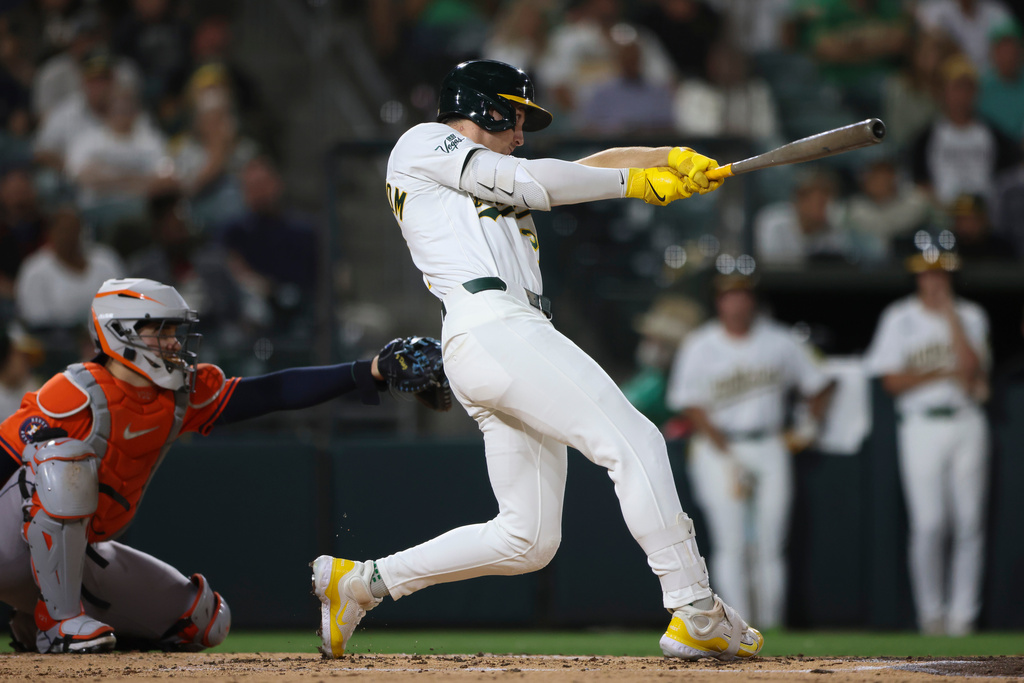 Athletics' Tyler Soderstrom hits an RBI double during the third inning of a baseball game against the Athletics, Wednesday, Sept. 24, 2025, in West Sacramento, Calif. (AP Photo/Scott Marshall)