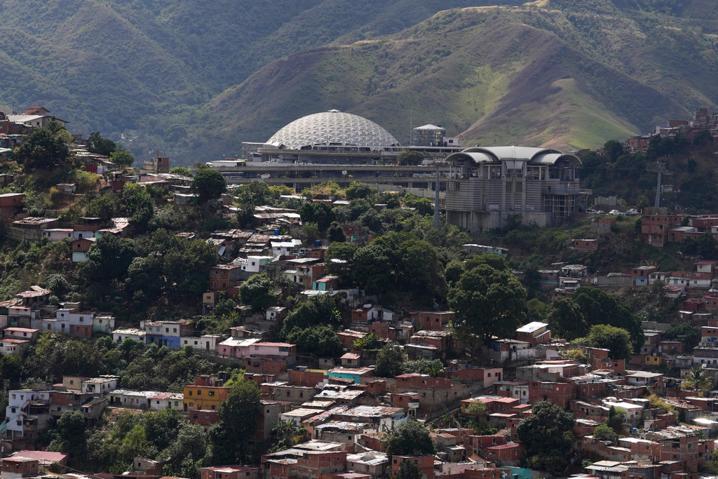 El Helicoide, top, the headquarters of Venezuela's intelligence service and detention center, stands in Caracas, Venezuela, Thursday, Jan. 8, 2026, after National Assembly President Jorge Rodriguez said the government would release a significant number of Venezuelan and foreign prisoners. (AP Photo/Matias Delacroix)