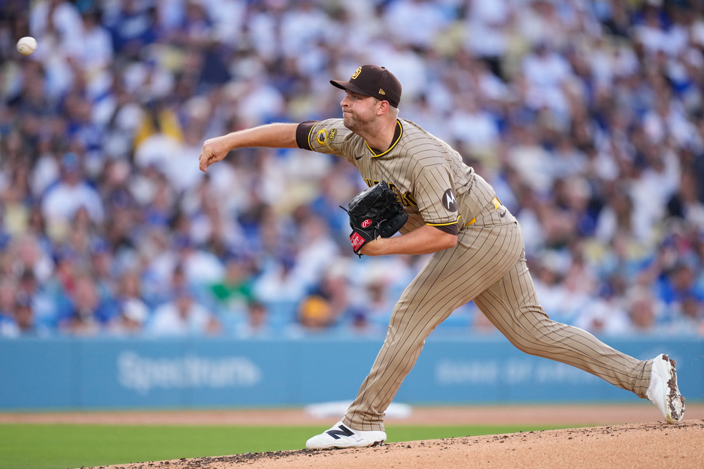 San Diego Padres starting pitcher Michael King throws to the plate during the first inning of a baseball game against the Los Angeles Dodgers, Friday, July 3, 2026, in Los Angeles. (AP Photo/Mark J. Terrill)