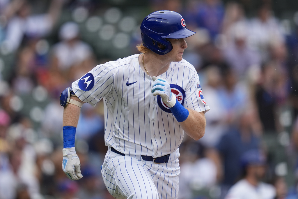 Chicago Cubs' Owen Caissie (19) runs the bases after hitting his first major league career home run during the sixth inning in the first baseball game of a doubleheader against the Milwaukee Brewers, Tuesday, Aug. 19, 2025, in Chicago. (AP Photo/Erin Hooley)