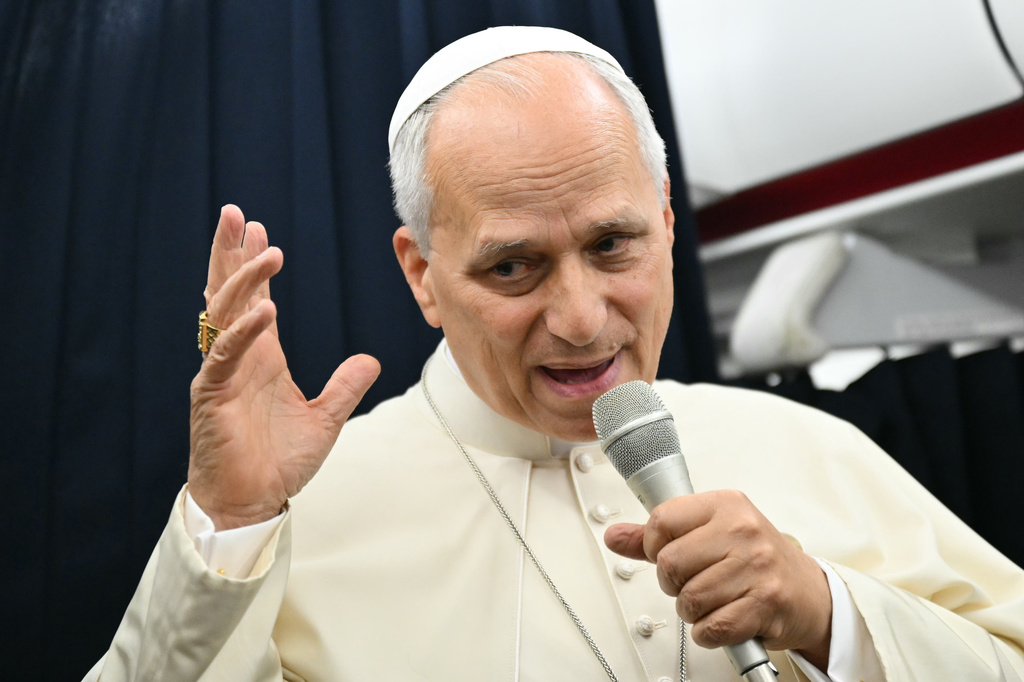 Pope Leo XIV speaks to journalists aboard the flight from Metz, France, to Rome, at the end of his four-day visit to France, Monday, Sept. 28, 2026. (Alberto Pizzoli/Pool Photo via AP)