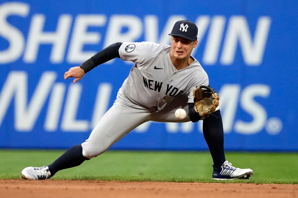New York Yankees shortstop Anthony Volpe fields a ground out by Philadelphia Phillies' Bryson Stott during the fifth inning of a baseball game Friday, July 24, 2026, in Philadelphia. (AP Photo/Matt Slocum)