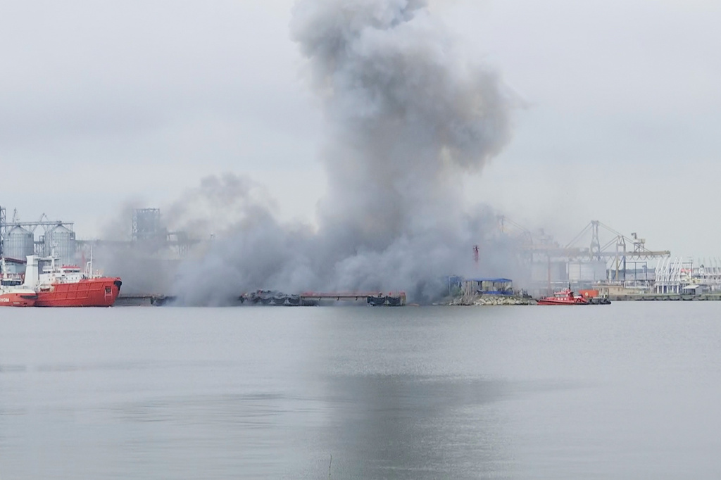 In this photo taken from video provided by OBSERVATOR ANTENA 1, smoke rises after an explosion of sea drone is seen in Constanta port, Romania, Friday, June 5, 2026. (OBSERVATOR ANTENA 1 via AP)