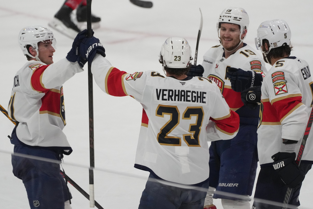 Florida Panthers center Carter Verhaeghe (23) celebrates his goal during the third period of an NHL hockey game against the Detroit Red Wings, Tuesday, March 10, 2026, in Sunrise, Fla. (AP Photo/Marta Lavandier)