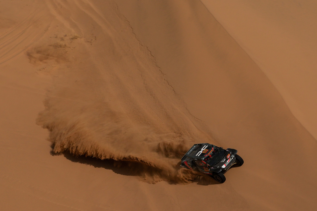 Driver Nasser Al-Attiyah and co-driver Fabian Lurquin compete during the twelfth stage of the Dakar Rally between Al Henakiyah and Yanbu, Saudi Arabia, Friday, Jan.16, 2026. (AP Photo/Thibault Camus)