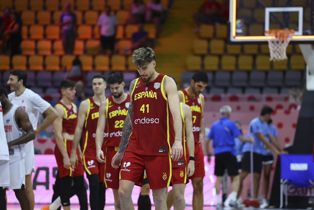 Spain's Juancho Hernangómez walks onto the court with teammates after loosing to Georgia during the EuroBasket, European Basketball Championship Group C match at the Spyros Kyprianou Arena in Limassol, Cyprus, Thursday, Aug. 28, 2025. (AP Photo/Chara Savvidou)