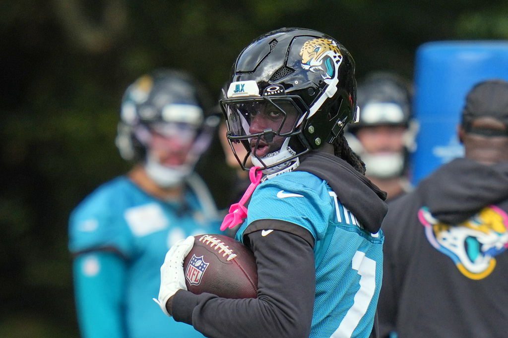 Jacksonville Jaguars wide receiver Brian Thomas Jr. (7) works out during an NFL football practice in Hertfordshire, England, Wednesday, Oct. 14, 2026. (AP Photo/Kin Cheung)