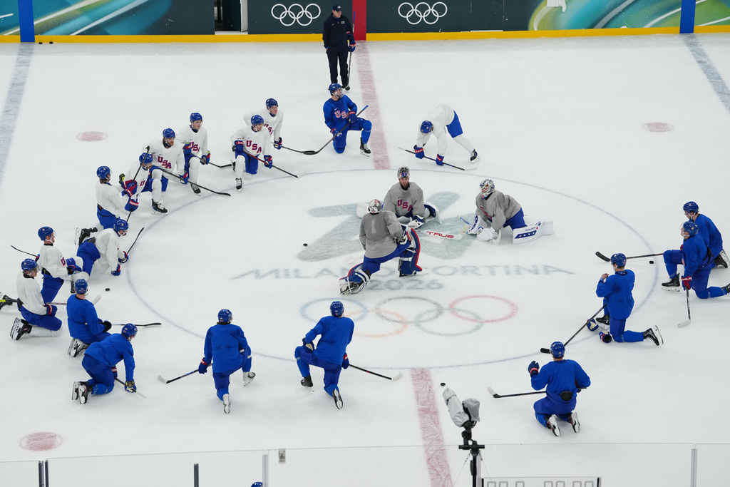 The United States men's ice hockey team gathers on the ice during practice at the 2026 Winter Olympics, in Milan, Italy, Sunday, Feb. 8, 2026. (AP Photo/Carolyn Kaster)