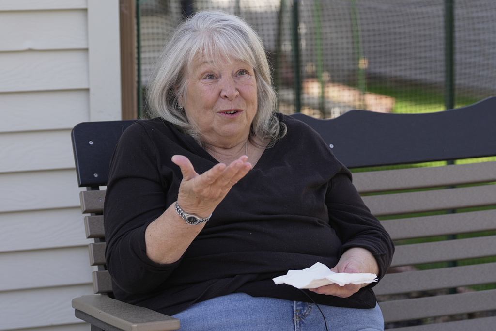 December Harris talks about a small black rock she suspects is a meteorite found by her cousin and roommate, Ambra Sinclair, on their driveway in Medina, Ohio, March 17, 2026, during an interview at her home Thursday, March 19. (AP Photo/Sue Ogrocki)