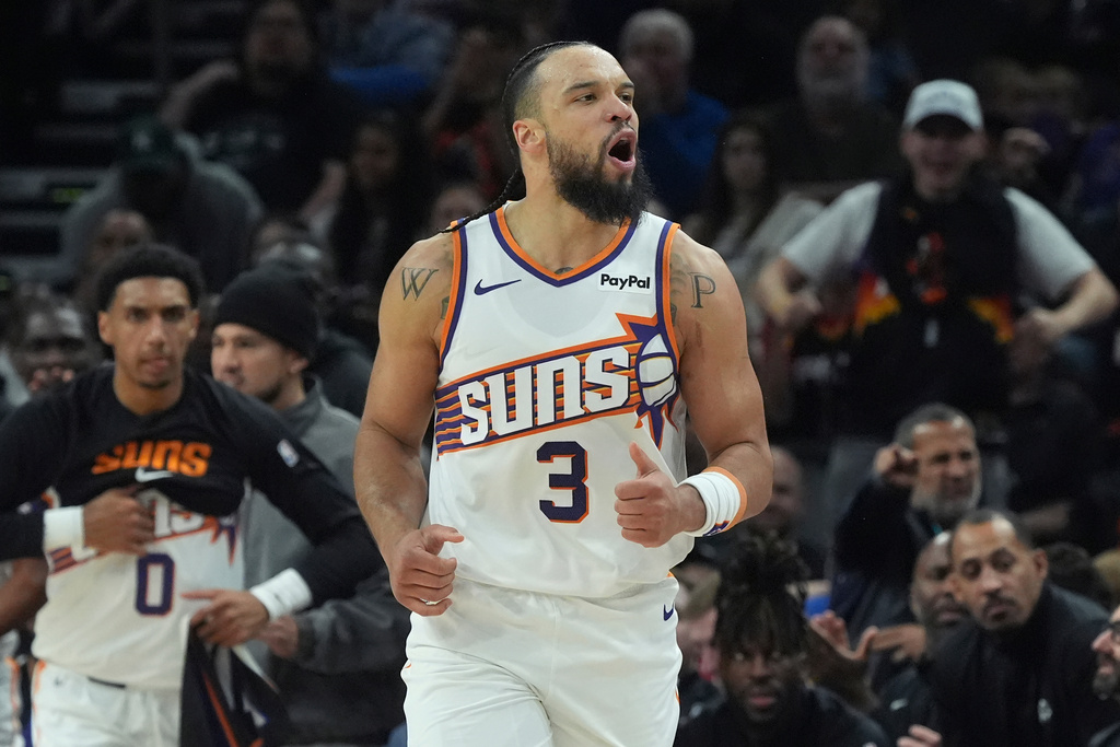 Phoenix Suns forward Dillon Brooks celebrates a made 3-pointer against the Detroit Pistons during the first half of an NBA basketball game Thursday, Jan. 29, 2026, in Phoenix. (AP Photo/Ross D. Franklin)