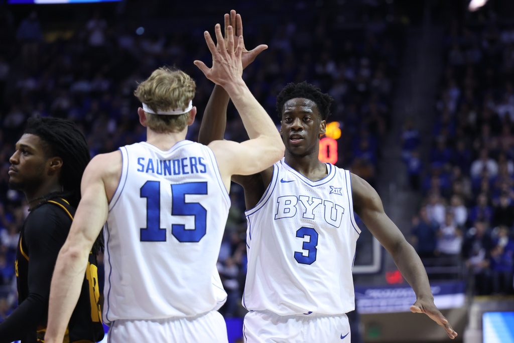BYU forward AJ Dybantsa (3) and guard Richie Saunders (15) react to a play against Arizona State during the first half of an NCAA basketball game, Wednesday, Jan. 7, 2026, in Provo, Utah. (AP Photo/Rob Gray)