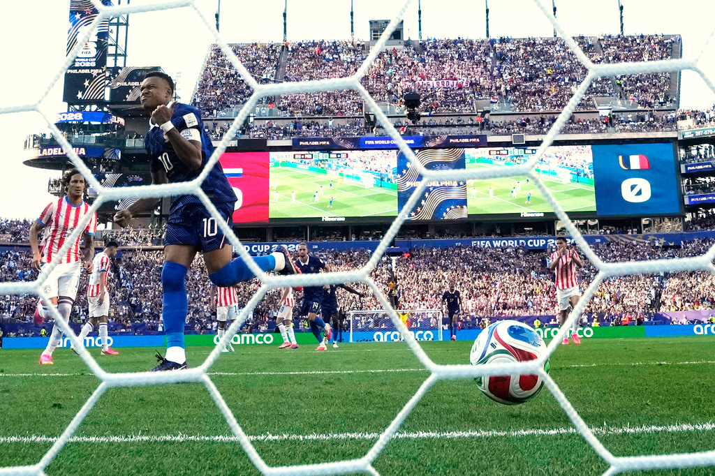 France's Kylian Mbappe (10) celebrates after scoring a goal from the penalty spot during the World Cup round of 16 soccer match between Paraguay and France in Philadelphia, Saturday, July 4, 2026. (AP Photo/Matt Slocum)