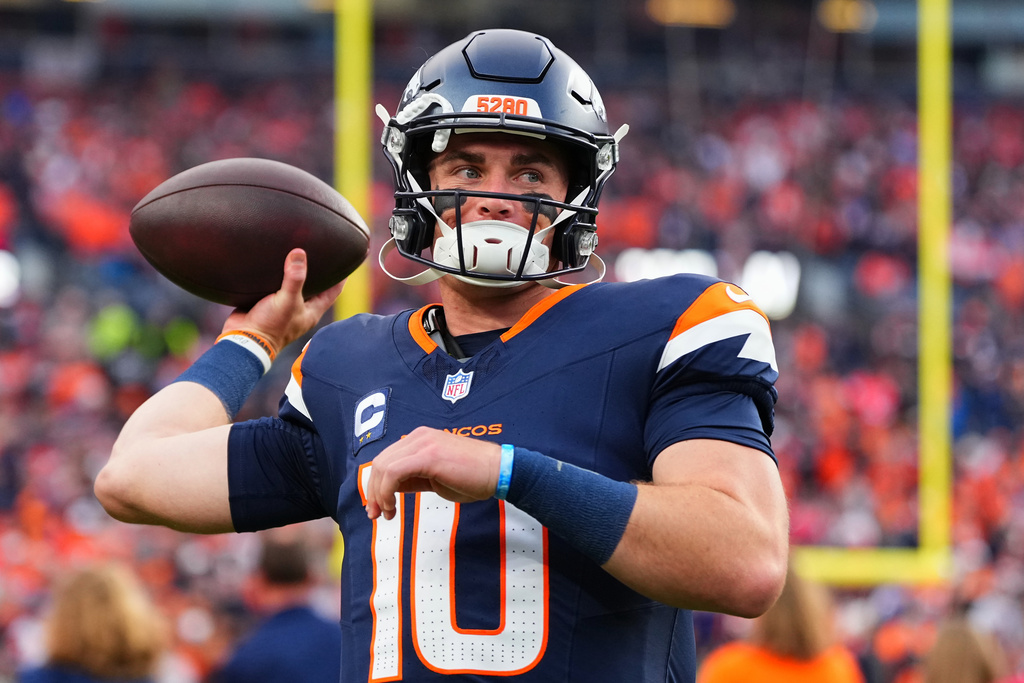 Denver Broncos quarterback Bo Nix (10) warms up before an NFL football game against the Cincinnati Bengals, Monday, Sept. 29, 2025, in Denver. (AP Photo/Jack Dempsey)