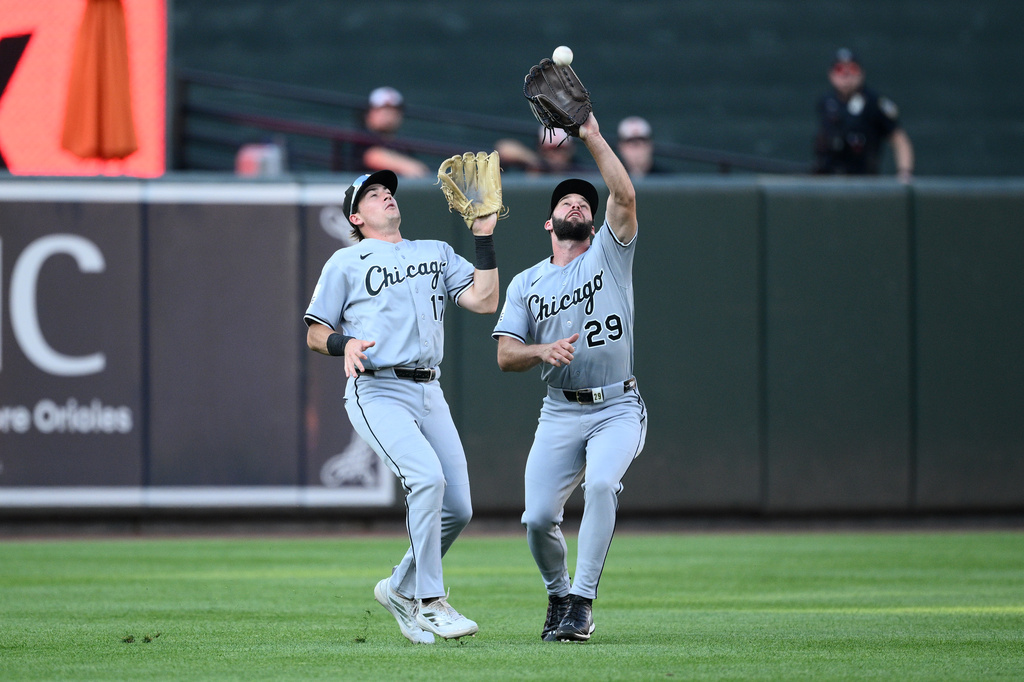 Chicago White Sox center fielder Tristan Peters (29) makes a catch for an out next to left fielder Sam Antonacci (17) on a fly ball hit by Baltimore Orioles' Samuel Basallo during the second inning of a baseball game, Monday, June 29, 2026, in Baltimore. (AP Photo/Nick Wass)