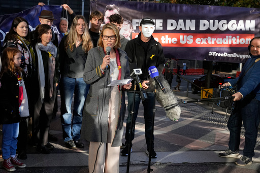 FILE -Saffrine Duggan speaks outside Downing Central Court in Sydney, May 24, 2024, where her husband Daniel was scheduled to appear. (AP Photo/Rick Rycroft, File) FILE -Saffrine Duggan speaks outside Downing Central Court in Sydney, May 24, 2024, where her husband Daniel was scheduled to appear. (AP Photo/Rick Rycroft, File)