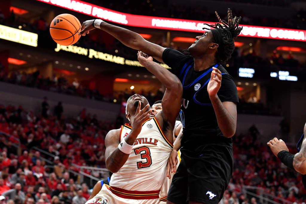 SMU center Jaden Toombs (10) blocks the shot of Louisville guard Ryan Conwell (3) during the second half of an NCAA college basketball game in Louisville, Ky., Saturday, Jan. 31, 2026. (AP Photo/Timothy D. Easley)