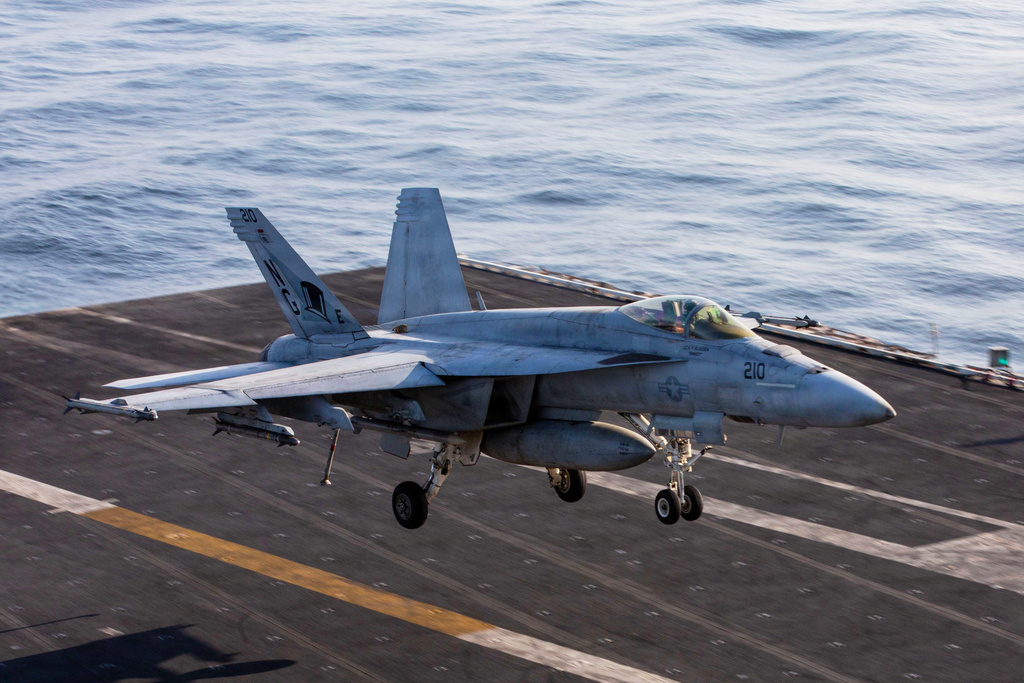 This image provided by U.S. Central Command shows a F/A-18E Super Hornet coming in for an arrested landing on USS Abraham Lincoln (CVN 72) after flying in support of Operation Epic Fury, on Saturday, Feb. 28, 2026. (U.S. Navy via AP)