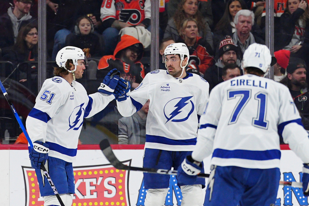 Tampa Bay Lightning's Nick Paul, center, celebrates after his goal with Charle-Edouard D'Astous (51) during the second period of an NHL hockey game against the Philadelphia Flyers, Saturday, Jan. 10, 2026, in Philadelphia. (AP Photo/Derik Hamilton)