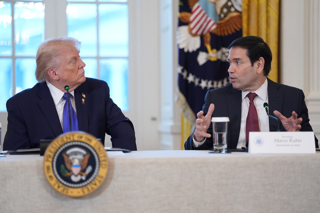 President Donald Trump listens as Secretary of State Marco Rubio speaks during a meeting with oil executives in the East Room of the White House, Friday, Jan. 9, 2026, in Washington. (AP Photo/Evan Vucci)