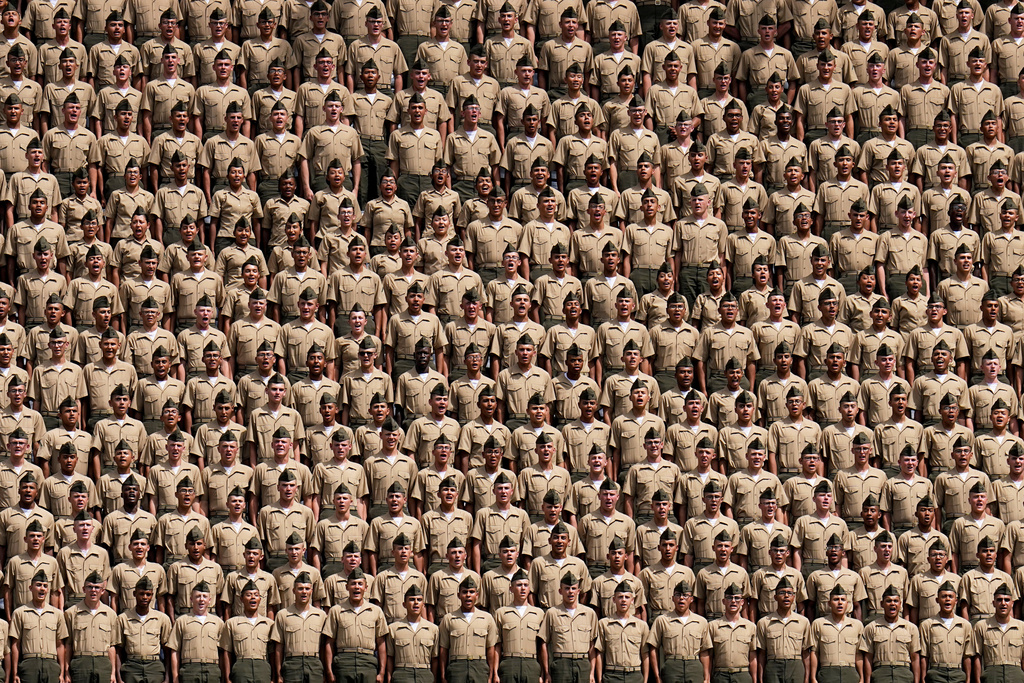 FILE - Marine recruits from Marine Corps Recruit Depot, San Diego, yell during the seventh inning of a baseball game between the San Diego Padres and the San Francisco Giants, Sept. 3, 2023, in San Diego. (AP Photo/Gregory Bull, File)