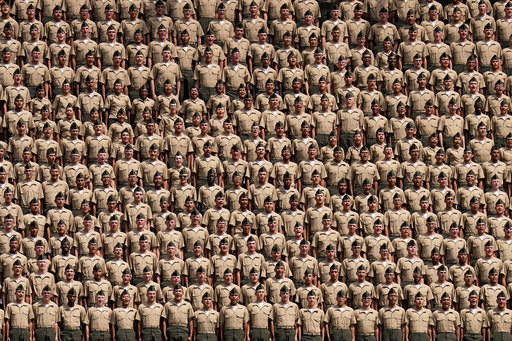 FILE - Marine recruits from Marine Corps Recruit Depot, San Diego, yell during the seventh inning of a baseball game between the San Diego Padres and the San Francisco Giants, Sept. 3, 2023, in San Diego. (AP Photo/Gregory Bull, File) FILE - Marine recruits from Marine Corps Recruit Depot, San Diego, yell during the seventh inning of a baseball game between the San Diego Padres and the San Francisco Giants, Sept. 3, 2023, in San Diego. (AP Photo/Gregory Bull, File)