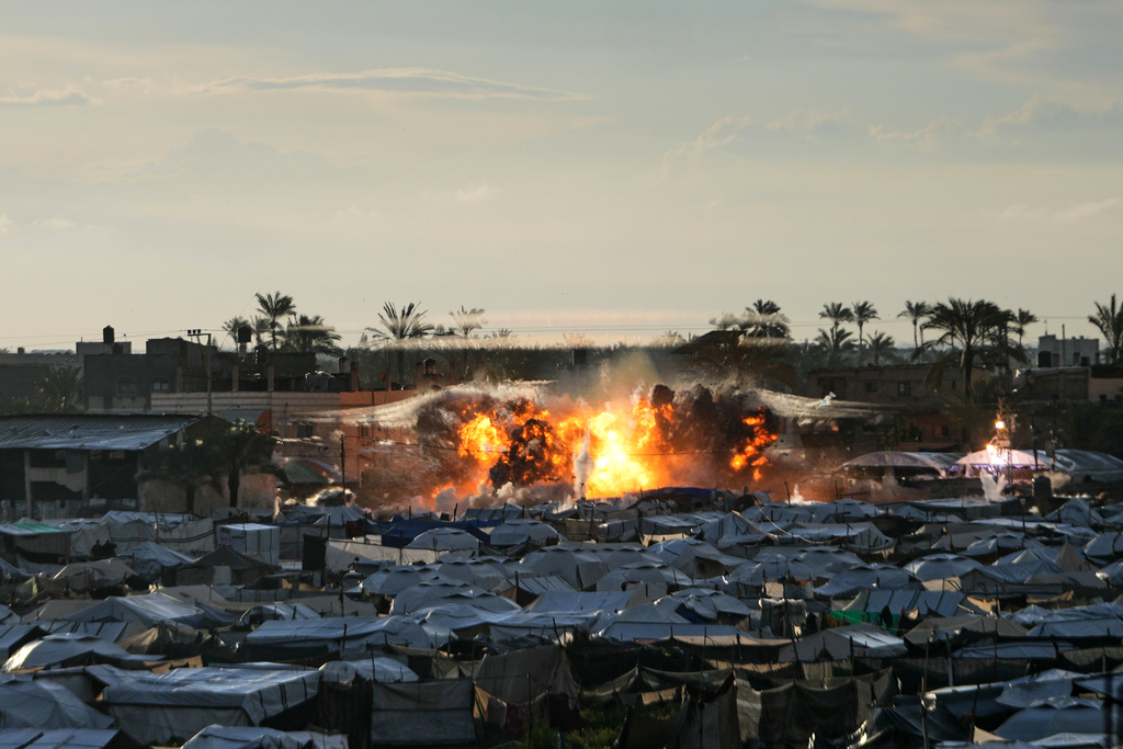 Smoke and flames rise following an Israeli military strike on a target in Deir al-Balah, central Gaza Strip, Wednesday, March, 25, 2026.(AP Photo/Abdel Kareem Hana)