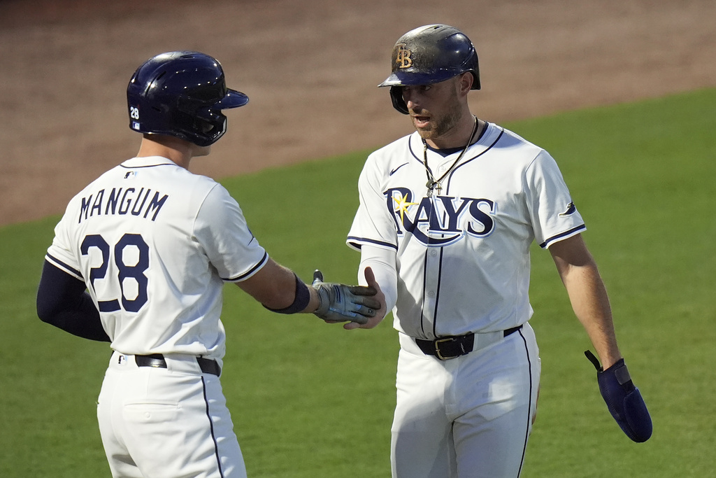 Tampa Bay Rays' Brandon Lowe celebrates with Jake Mangum (28) after owe scored on a fieldeer's choice by Josh Lowe off Seattle Mariners pitcher Bryan Woo during the first inning of a baseball game Tuesday, Sept. 2, 2025, in Tampa, Fla. (AP Photo/Chris O'Meara)