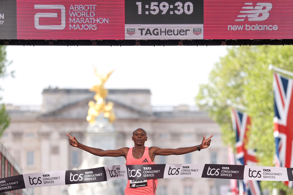 Sabastian Sawe from Kenya crosses the finish line to win the men's race at the London Marathon in London, Sunday, April 26, 2026.(AP Photo/Ian Walton)