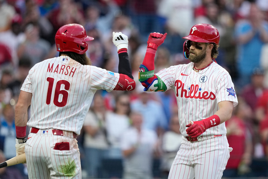 Philadelphia Phillies' Bryce Harper, right, and Brandon Marsh celebrate after Harper's two-run home run against San Diego Padres pitcher Randy Vásquez during the fourth inning of a baseball game Tuesday, June 2, 2026, in Philadelphia. (AP Photo/Matt Slocum)