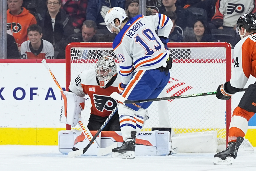 Philadelphia Flyers goaltender Dan Vladar deflects a shot by Edmonton Oilers' Adam Henrique during the second period of an NHL hockey game, Wednesday, Nov. 12, 2025, in Philadelphia. (AP Photo/Matt Rourke)