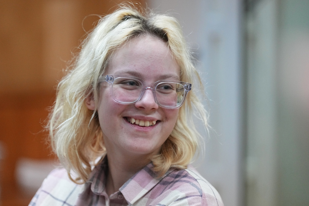 Diana Loginova, an 18-year-old Russian singer of Stoptime street band who served two consecutive 13-day prison sentences on various misdemeanor charges, sits during a court session in St. Petersburg, Russia, Tuesday, Nov. 11, 2025. (AP Photo/Dmitri Lovetsky
