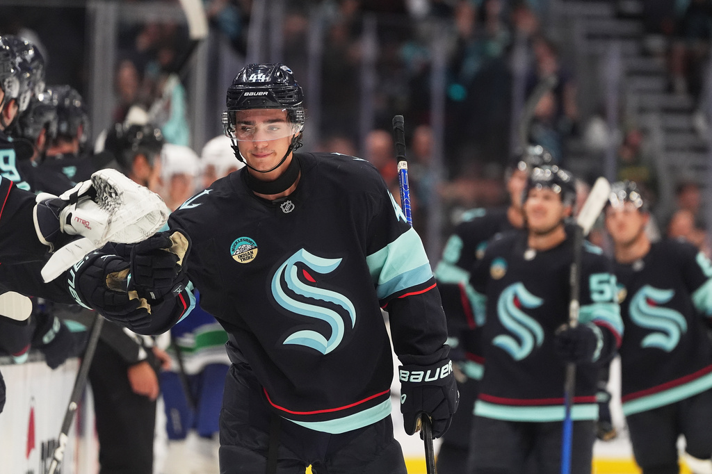 Seattle Kraken forward Jake O'Brien celebrates scoring against the Vancouver Canucks during the third period of a preseason NHL hockey game, Saturday, Sept. 19, 2026, in Seattle. (AP Photo/Lindsey Wasson)