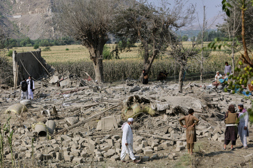 Residents inspect the rubble of a house destroyed in a strike in Patan village, Kunar province, eastern Afghanistan, Monday, Sept. 21, 2026. (AP Photo/Shafiullah Kakar)
