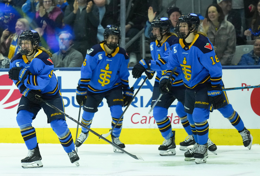 Toronto Sceptres forward Daryl Watts (9) celebrates her goal with teammates while playing against the Minnesota Frost during second period PWHL hockey action in Toronto on Sunday, March 8, 2026. (Nathan Denette/The Canadian Press via AP)
