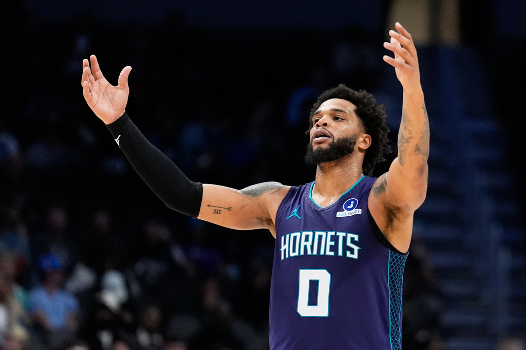 Charlotte Hornets forward Miles Bridges celebrates after scoring against the Milwaukee Bucks during the second half of an NBA basketball game Wednesday, Nov. 12, 2025, in Charlotte, N.C. (AP Photo/Chris Carlson)