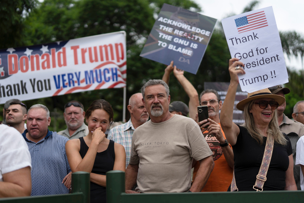 FILE - White South Africans demonstrate in support of U.S. President Donald Trump in front of the U.S. embassy in Pretoria, South Africa, Feb. 15, 2025. (AP Photo/Jerome Delay, File)