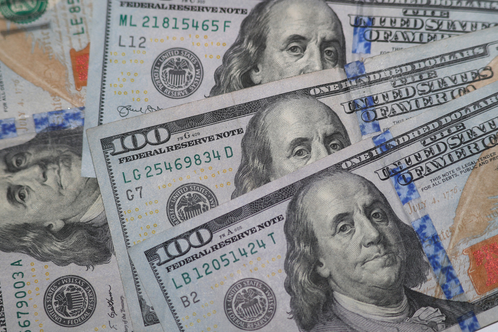 FILE - Hundred dollar bills are seen in Dallas on Jan. 22, 2020. (AP Photo/LM Otero, File)
