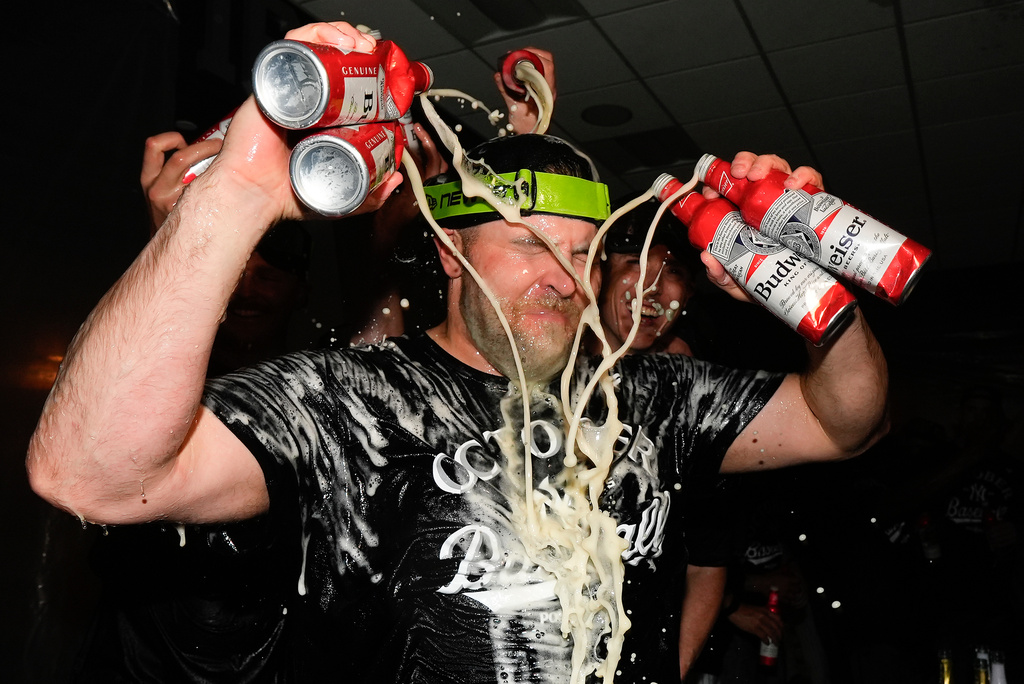 New York Yankees pitcher David Bednar (53) sprays himself with beer while celebrating with teammates after the Yankees defeated the Boston Red Sox in Game 3 of an American League wild-card baseball playoff series, Thursday, Oct. 2, 2025, in New York. (AP Photo/Yuki Iwamura)