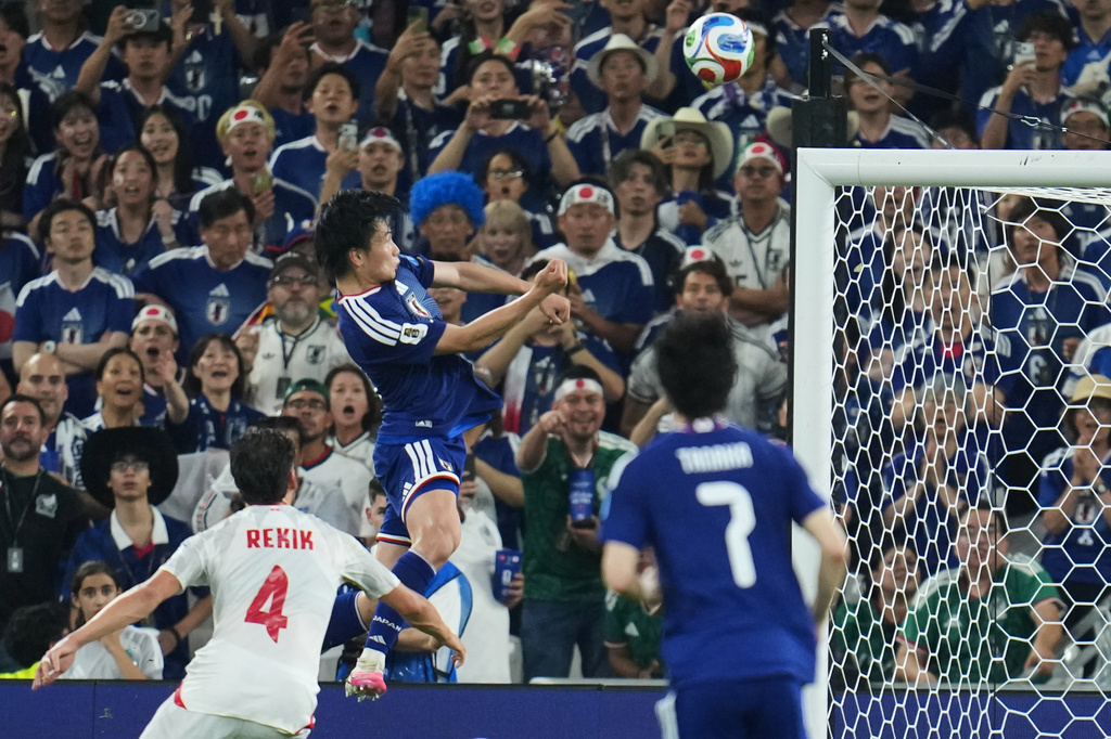 Japan's Ayase Ueda, center, scores their fourth goal with a header against Tunisia during the World Cup Group F soccer match in Guadalupe, near Monterrey, Mexico, Saturday, June 20, 2026. (AP Photo/Matias Delacroix)
