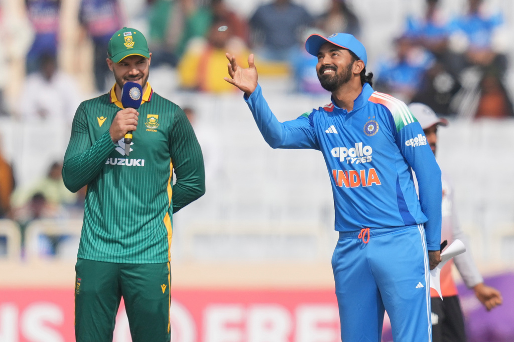 India's captain KL Rahul, right, flips coin for the toss as South Africa's captain Aiden Markram looks on during the first One Day International match between India and South Africa in Ranchi, India, Sunday, Nov. 30, 2025. (AP Photo/Rafiq Maqbool)