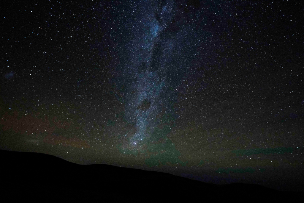 The Milky Way stretches across the night sky as seen from the Atacama Desert, Chile, Wednesday, April 15, 2026. (AP Photo/Esteban Felix)