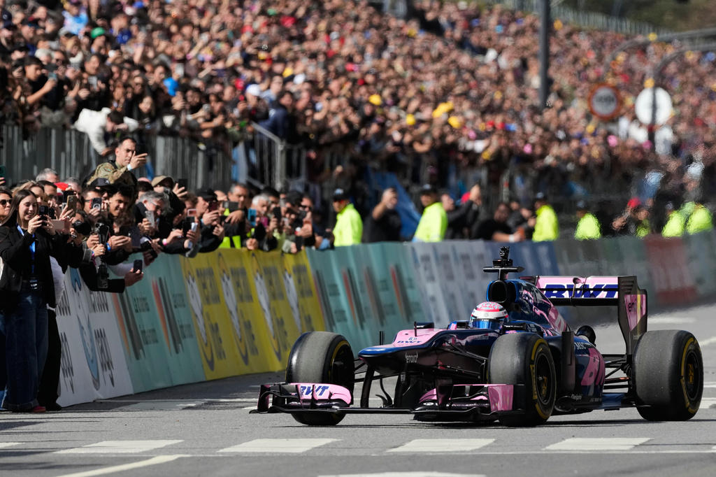 Argentine Alpine Formula 1 driver Franco Colapinto drives during a demonstration run in Buenos Aires, Argentina, Sunday, April 26, 2026. (AP Photo/Gustavo Garello)