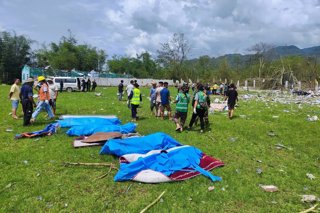 This handout photo provided by Ta'ang women organization shows bodies of victims in a row after an explosion Namhkam township, Shan State, Myanmar, Sunday, May 31, 2026. (Ta'ang women organization via AP)