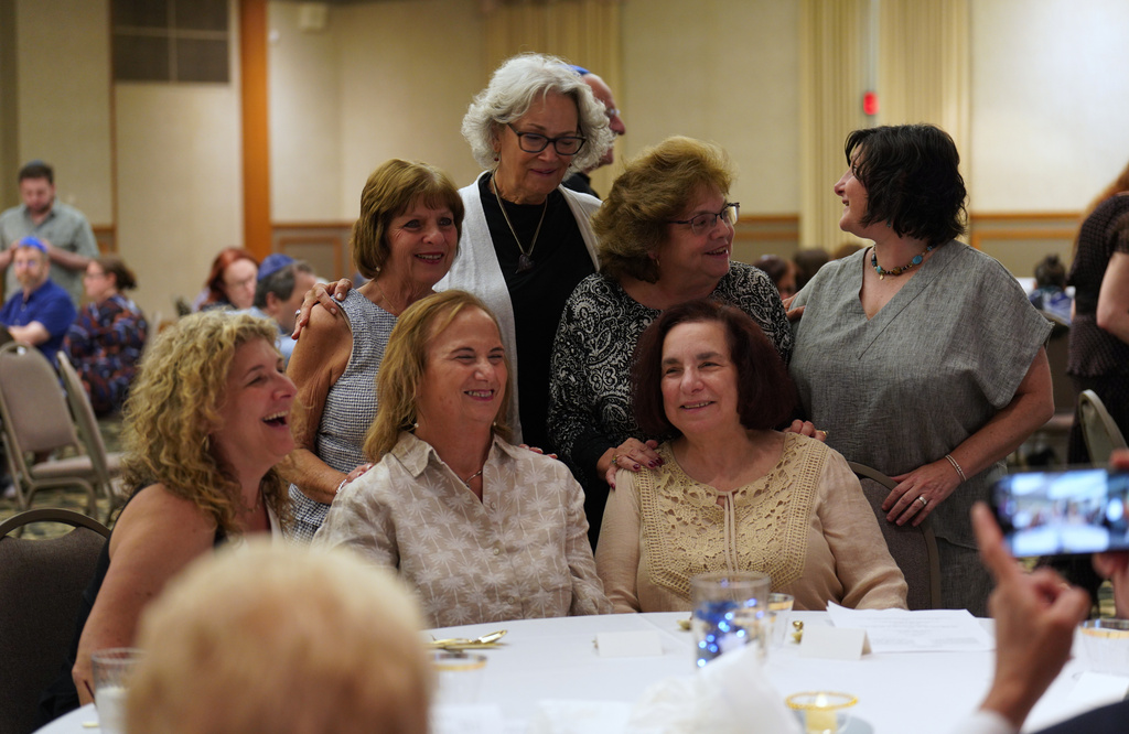 Friends, family and community members gather for the retirement dinner celebration of Rabbi Jeffrey Myers of the Tree of Life Congregation on Friday, July 17, 2026, at Rodef Shalom Congregation in Pittsburgh. (AP Photo/Jessie Wardarski)
